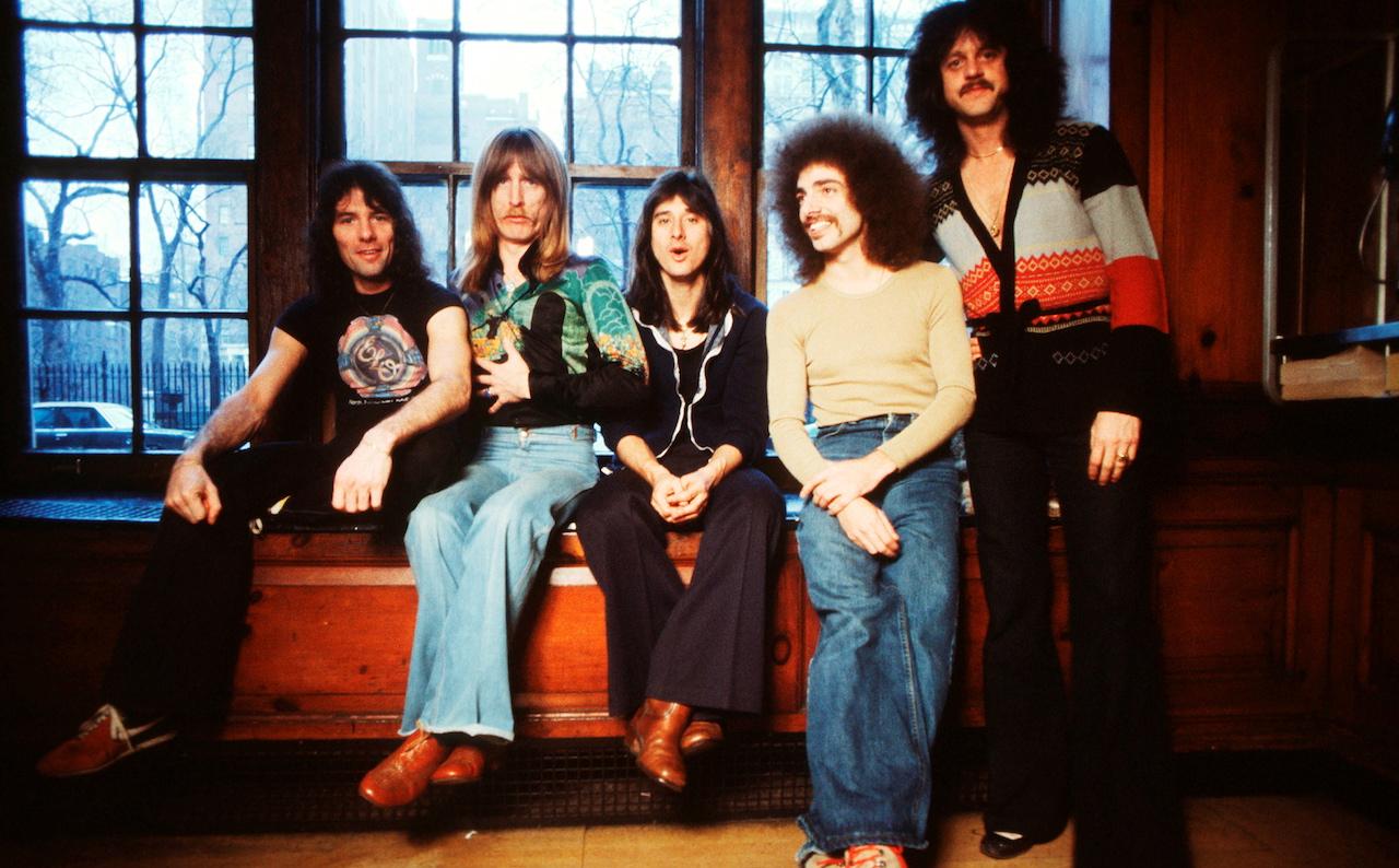 A classic Infinity-era band portrait featuring Steve Perry.