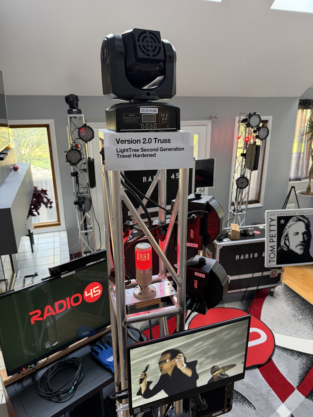 Lighting truss with moving fixtures and video displays at SodaPop House